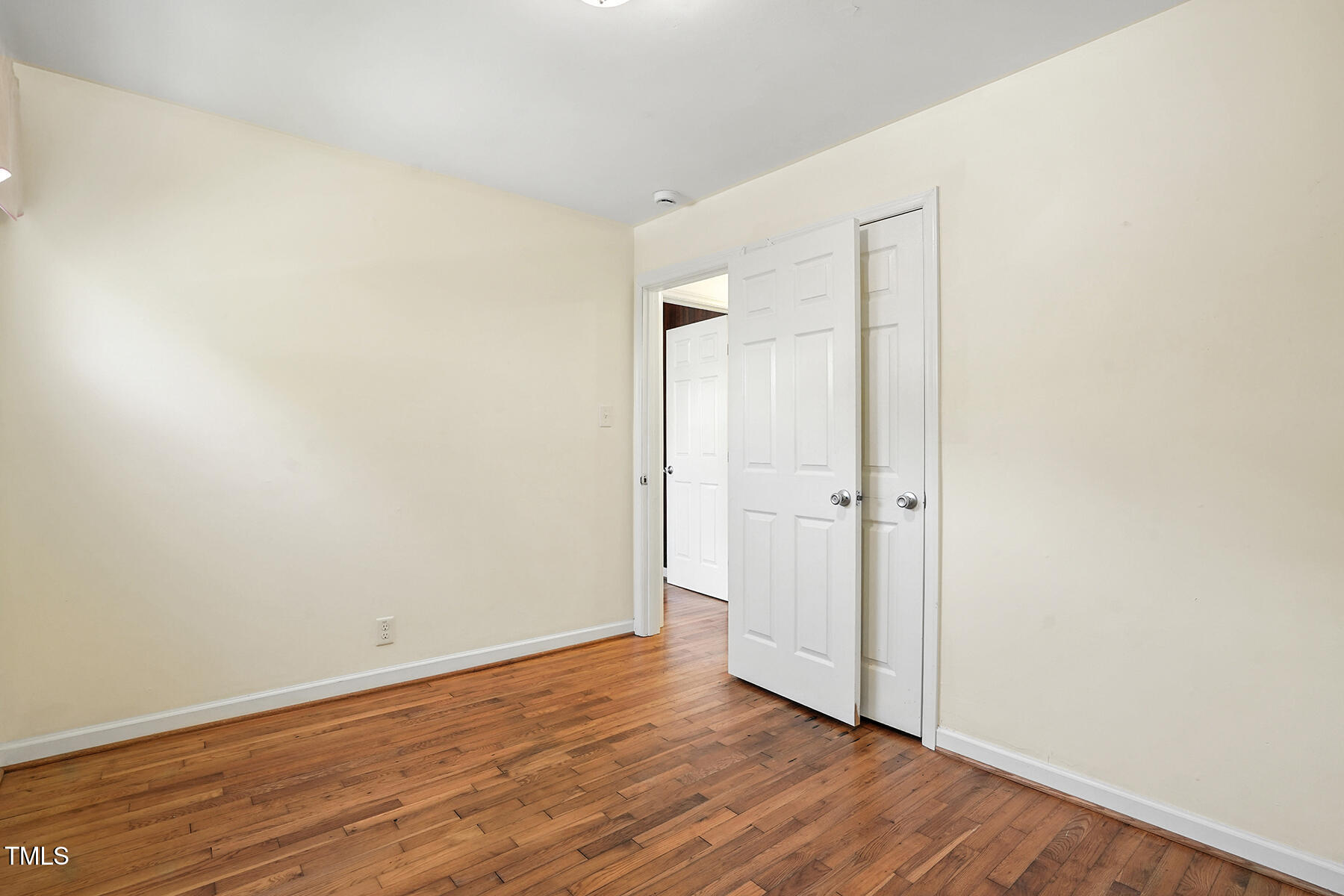 912 Dixie Trail Raleigh, NC 27607 - Photo 20 of 27 a view of an empty room with wooden floor