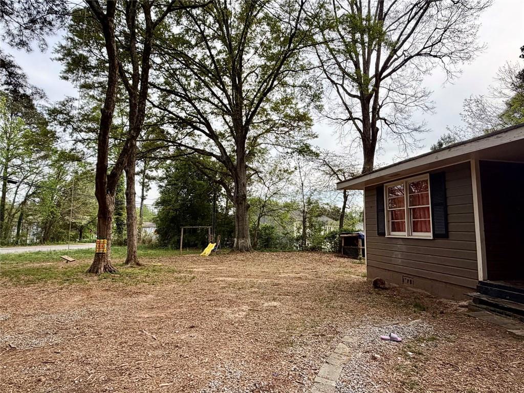 5411 Williams Road Norcross, GA 30093 - Photo 4 of 4 a backyard of a house with lots of green space