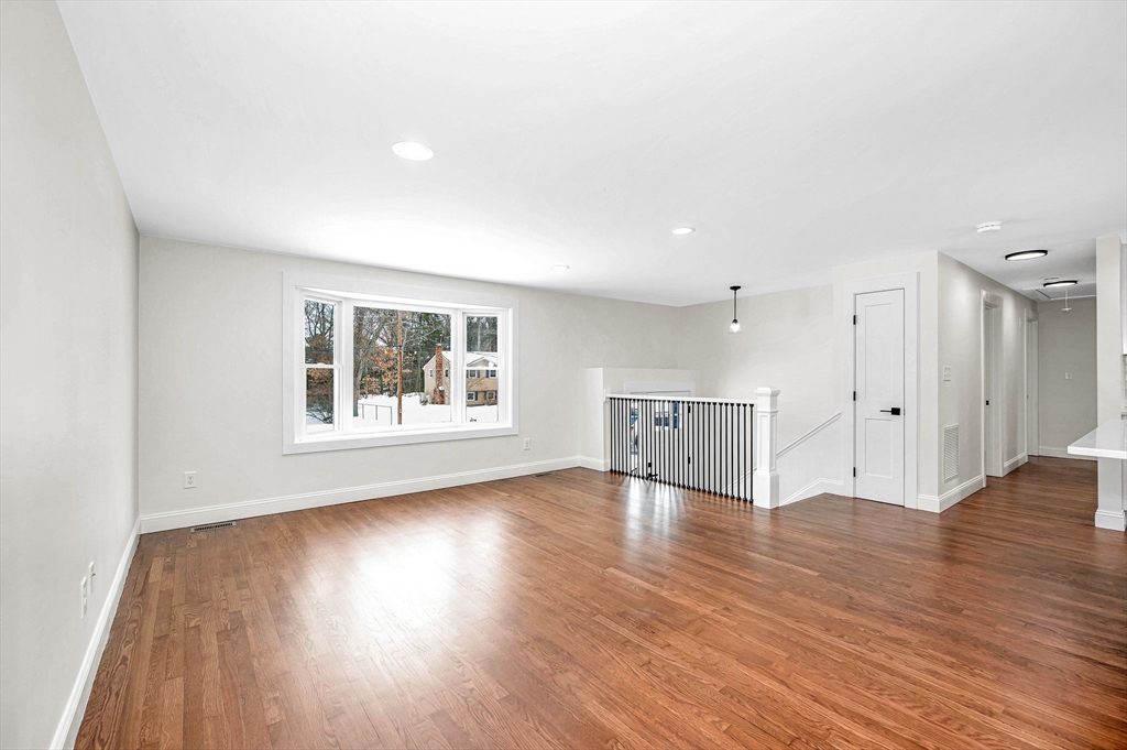 19 Porter Street Billerica, MA 01821 - Photo 2 of 42 a view of an empty room with wooden floor and a window