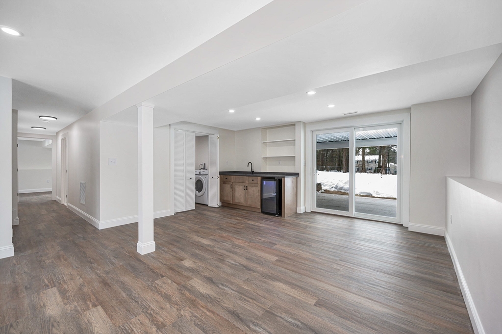 19 Porter Street Billerica, MA 01821 - Photo 23 of 42 a view of a big room with wooden floor and windows