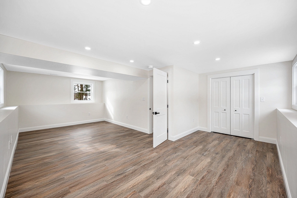 19 Porter Street Billerica, MA 01821 - Photo 32 of 42 a view of an empty room with wooden floor and a window