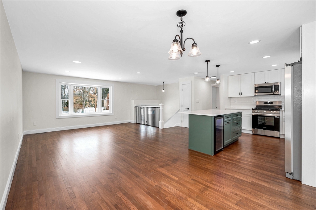 19 Porter Street Billerica, MA 01821 - Photo 5 of 42 a view of kitchen with cabinets and wooden floor