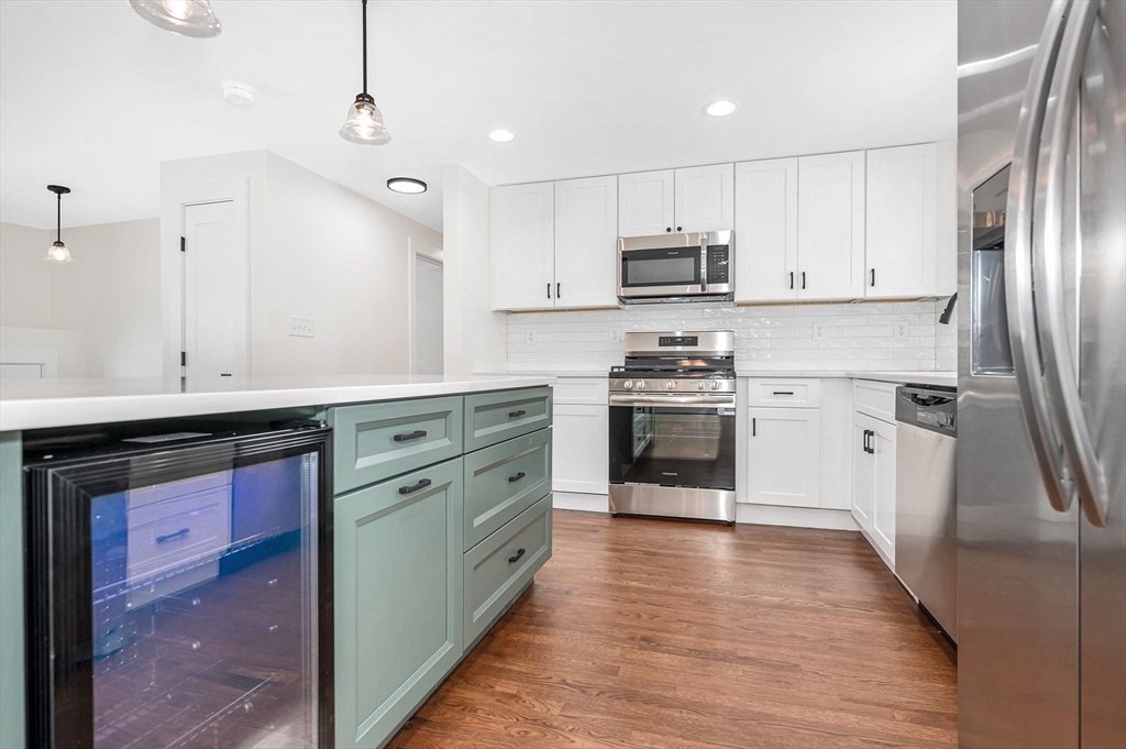 19 Porter Street Billerica, MA 01821 - Photo 10 of 42 a kitchen with stainless steel appliances granite countertop a stove a sink and a refrigerator