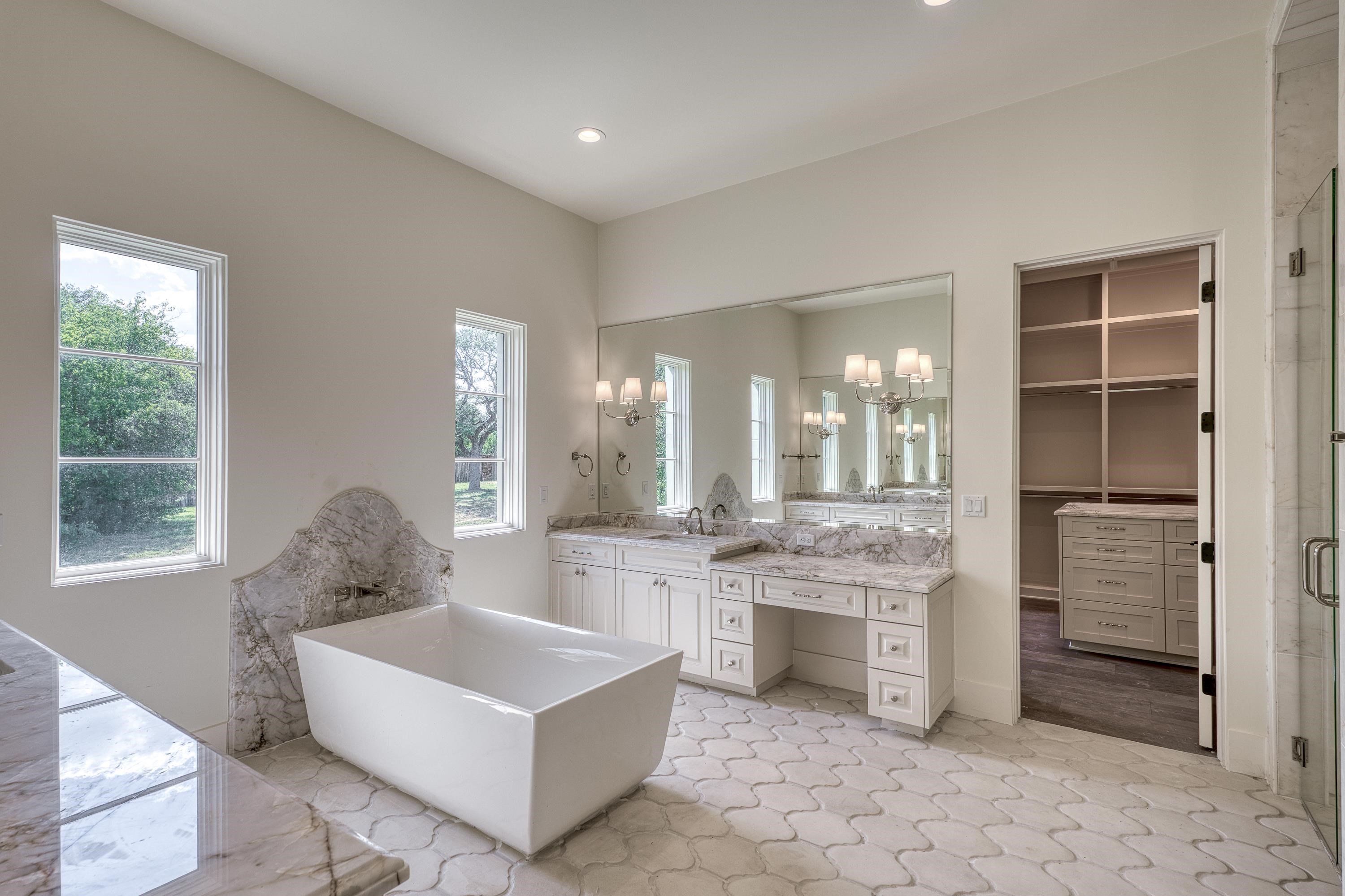 369 La Serena Loop Horseshoe Bay, TX 78657 - Photo 17 of 30 a living room with granite countertop furniture and a large window