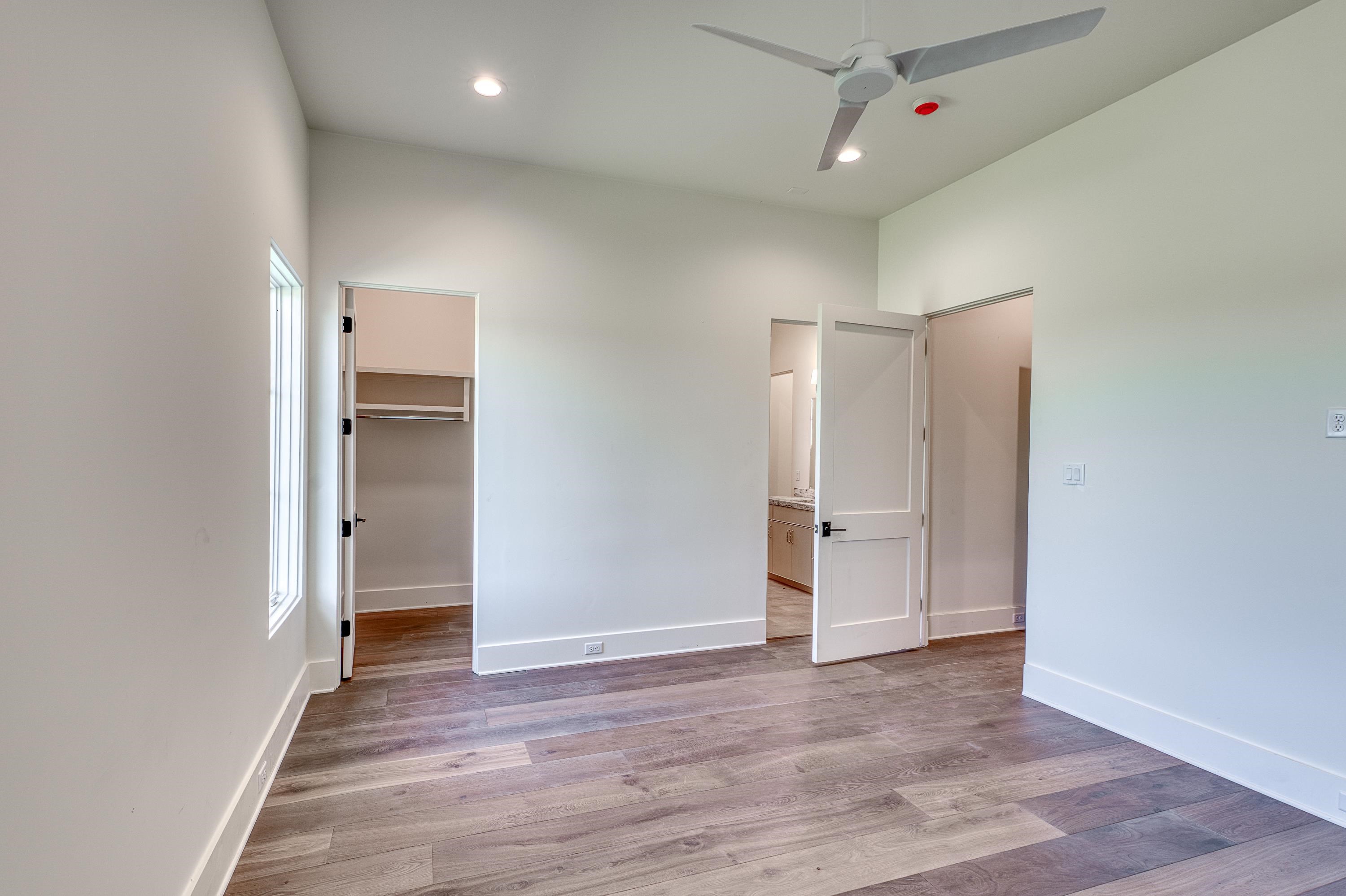 369 La Serena Loop Horseshoe Bay, TX 78657 - Photo 21 of 30 a view of an empty room and wooden floor