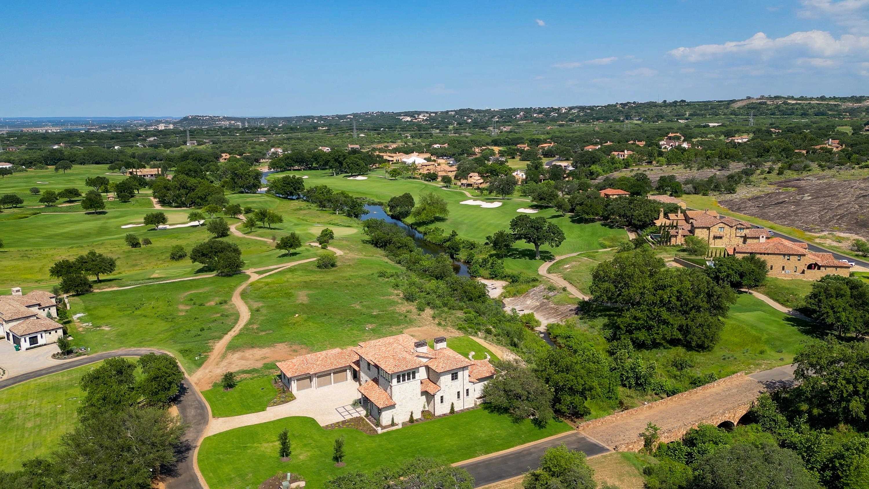369 La Serena Loop Horseshoe Bay, TX 78657 - Photo 28 of 30 an aerial view of residential houses with outdoor space and trees