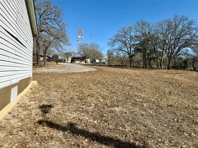 a view of open space with yard