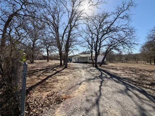 a view of a yard covered with snow in the background