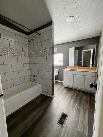 a bathroom with a bathtub and a sink