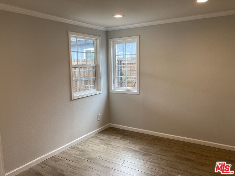903 Arnold Drive Placentia, CA 92870 - Photo 8 of 11 wooden floor in an empty room with a window