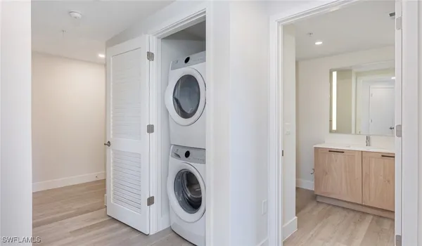 a view of a hallway with washer and dryer