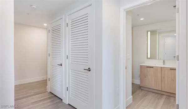 a view of a bathroom with a sink and a mirror