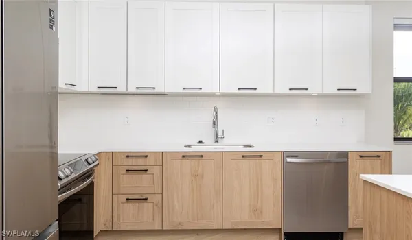 a view of cabinets and wooden floor