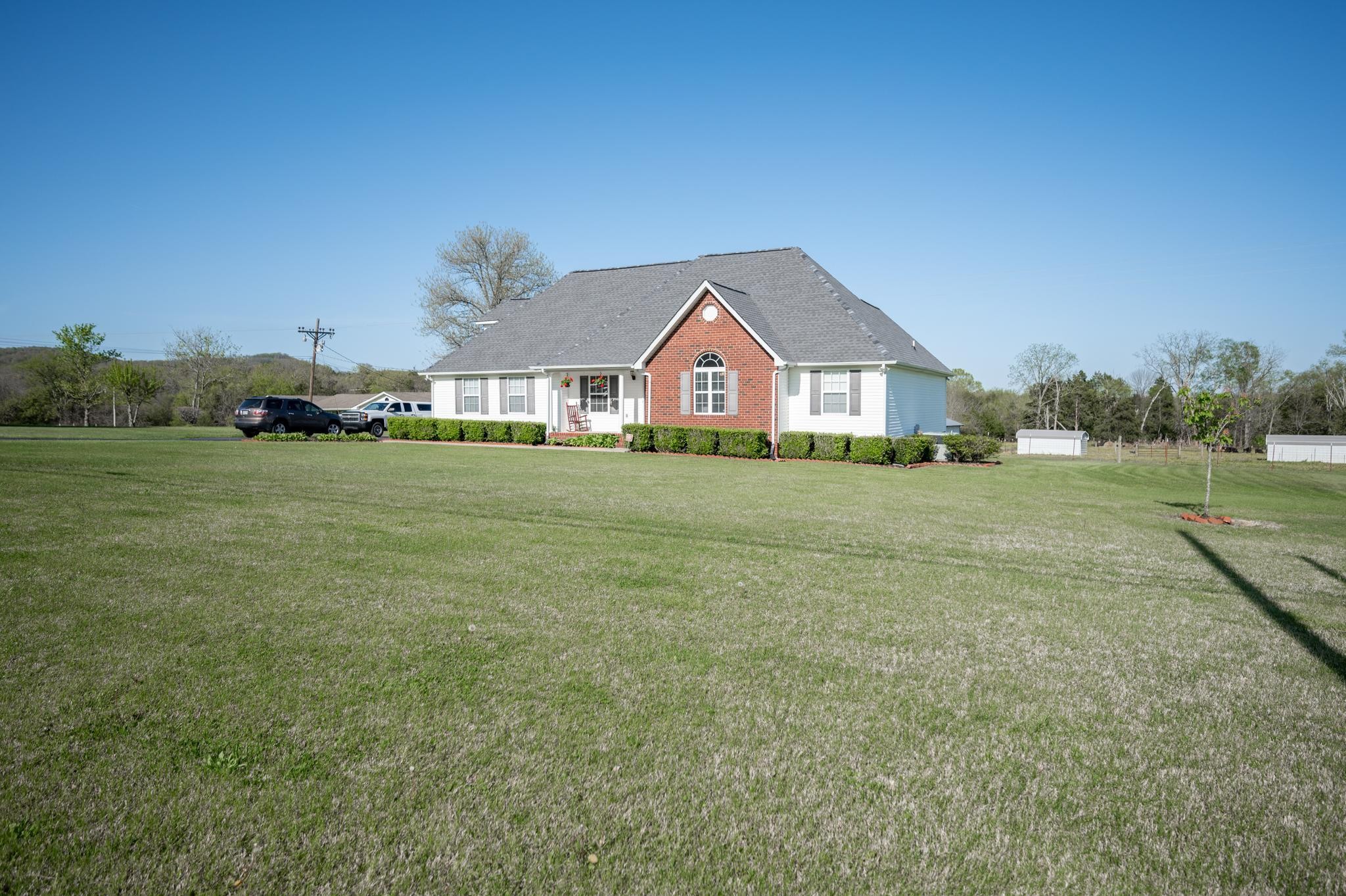 13459 Versailles Road Rockvale, TN 37153 - Photo 2 of 40 a view of a big yard with a house in the background