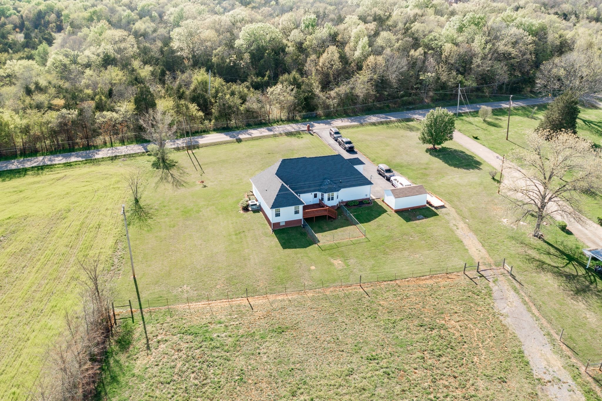13459 Versailles Road Rockvale, TN 37153 - Photo 30 of 40 a view of a swimming pool with a yard