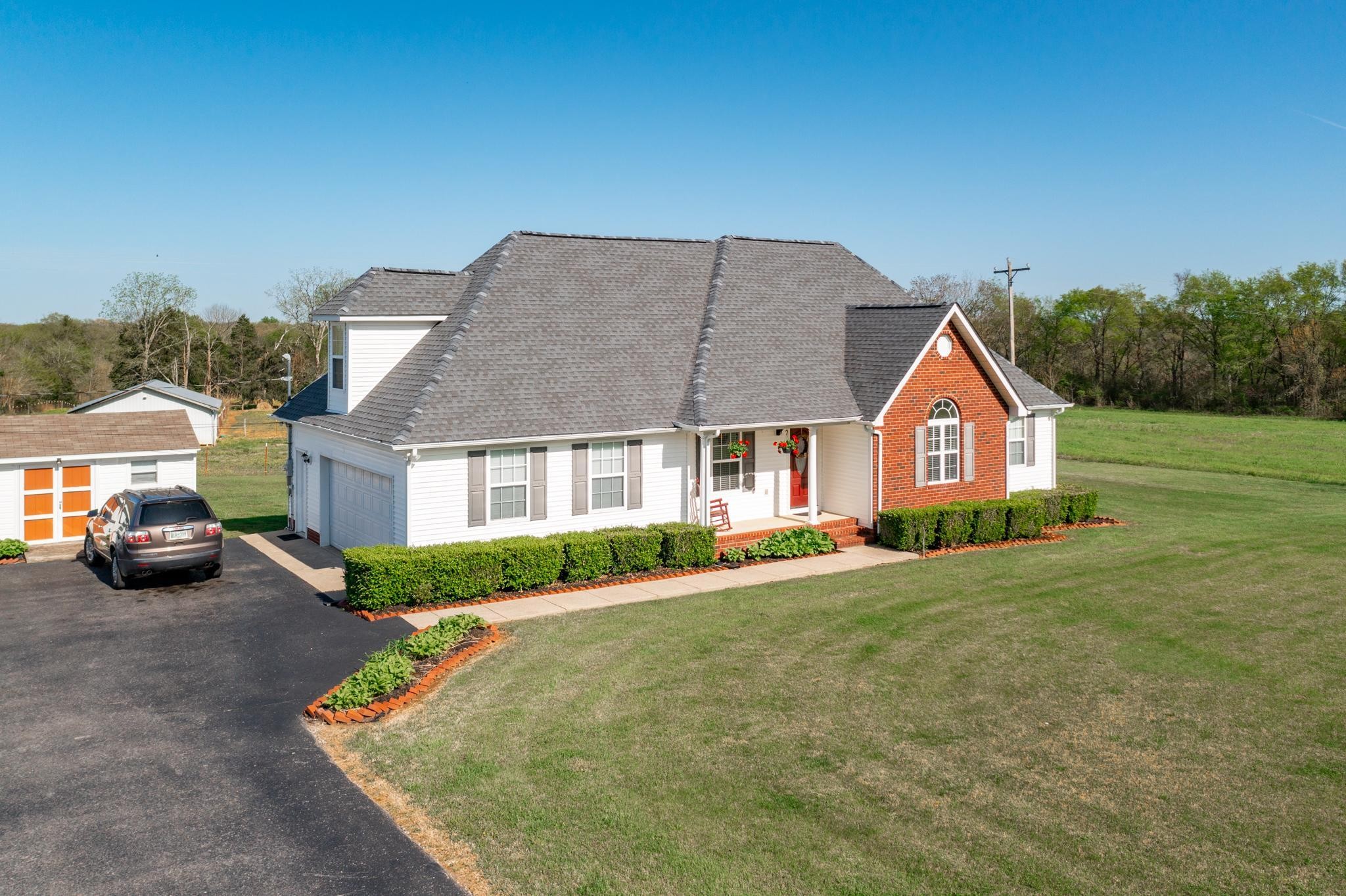 13459 Versailles Road Rockvale, TN 37153 - Photo 37 of 40 a front view of a house with garden
