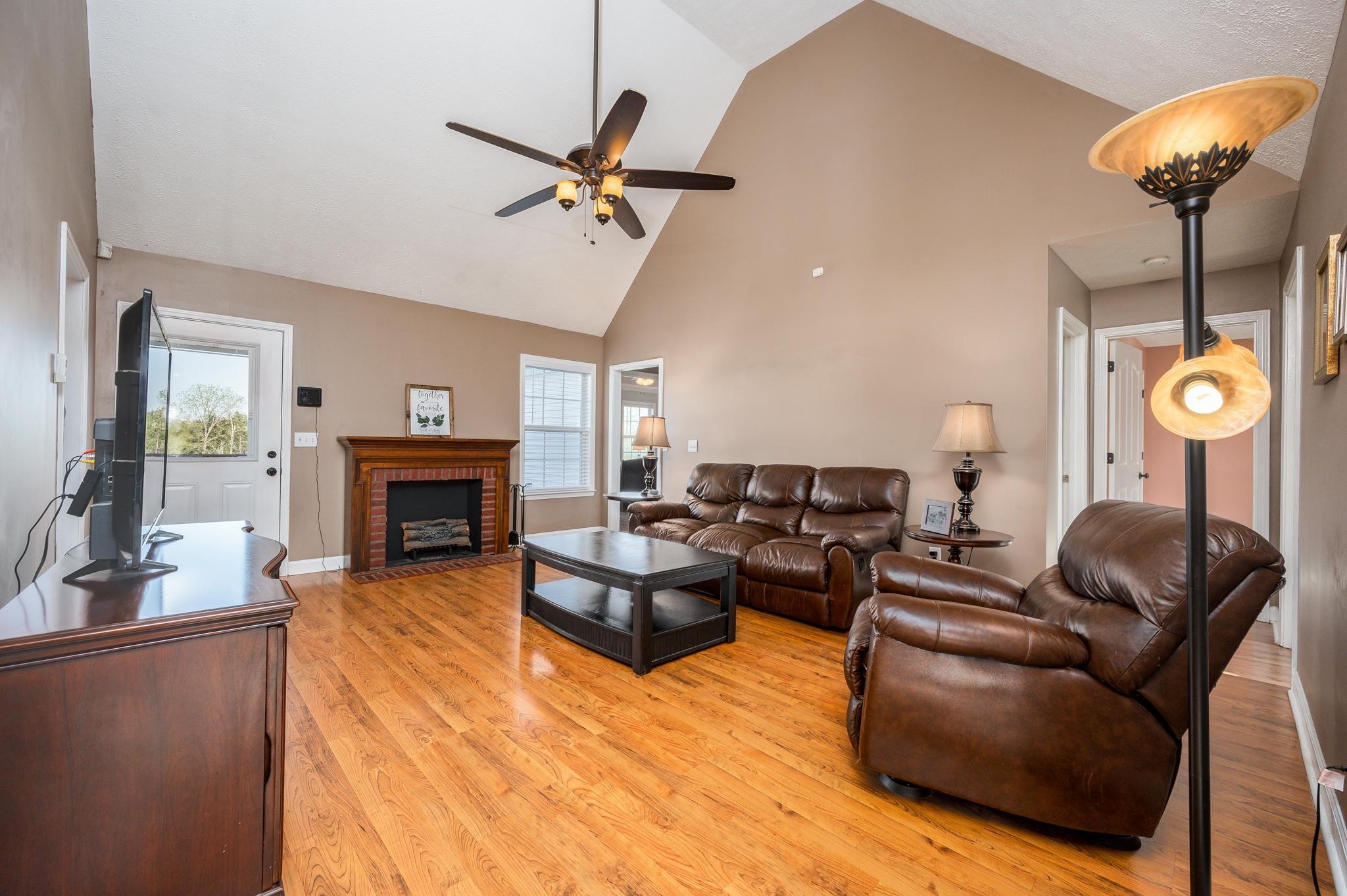 13459 Versailles Road Rockvale, TN 37153 - Photo 6 of 40 a living room with furniture and a fireplace