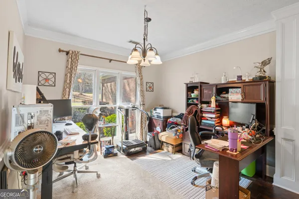 a view of a livingroom with furniture and a window