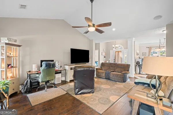 a living room with furniture and a flat screen tv