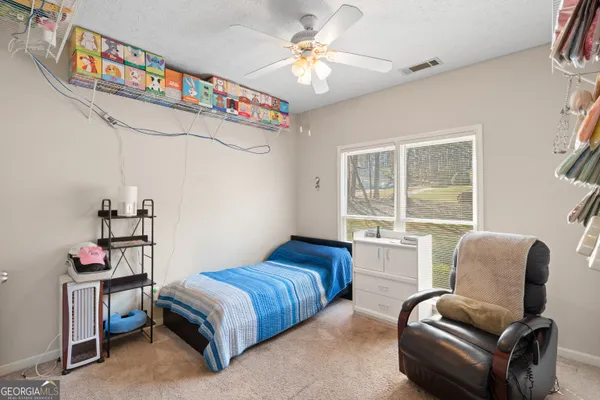 a bedroom with furniture and a chandelier