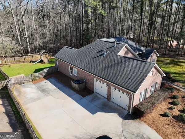 a view of a back yard with a patio