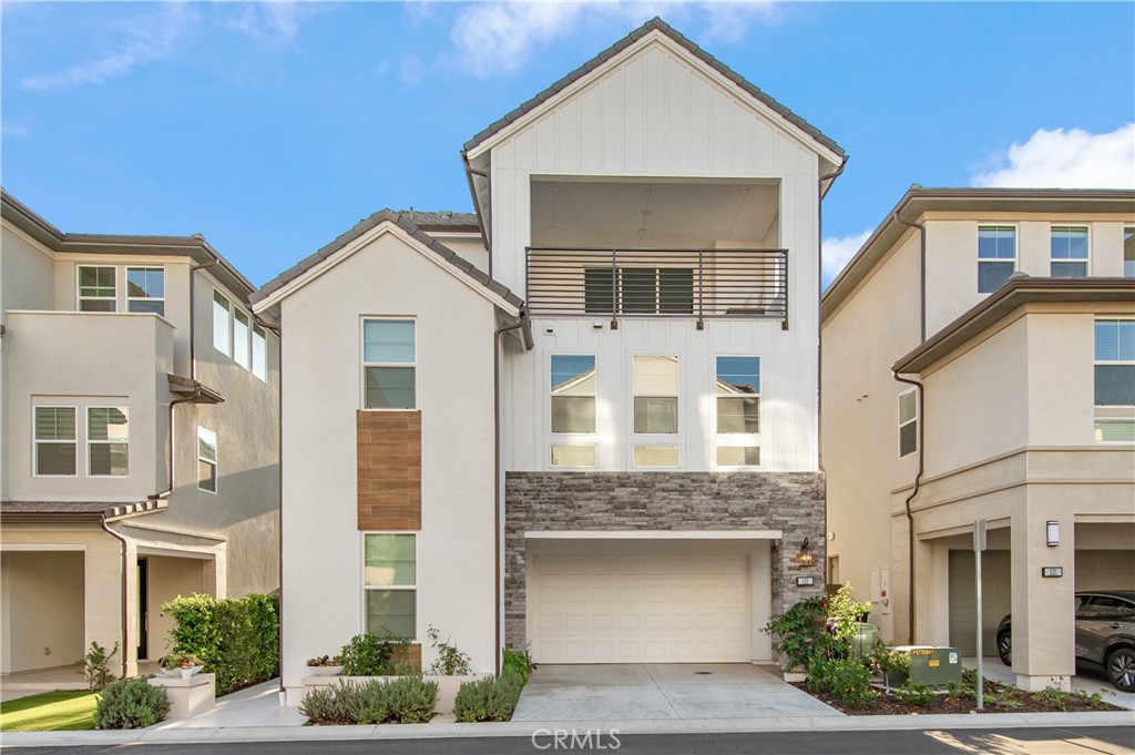 131 Reyes Alley Lake Forest, CA 92630 - Photo 1 of 39 a front view of a house