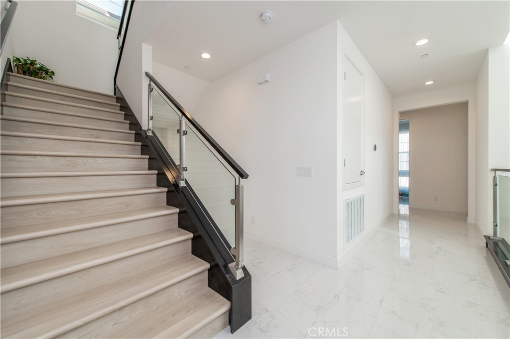 131 Reyes Alley Lake Forest, CA 92630 - Photo 18 of 39 a view of entryway and hall with wooden floor
