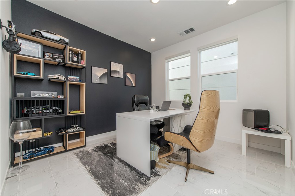 131 Reyes Alley Lake Forest, CA 92630 - Photo 20 of 39 a view of a workspace with furniture and a window