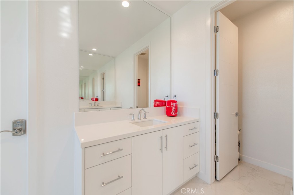 131 Reyes Alley Lake Forest, CA 92630 - Photo 27 of 39 a bathroom with a sink vanity and mirror