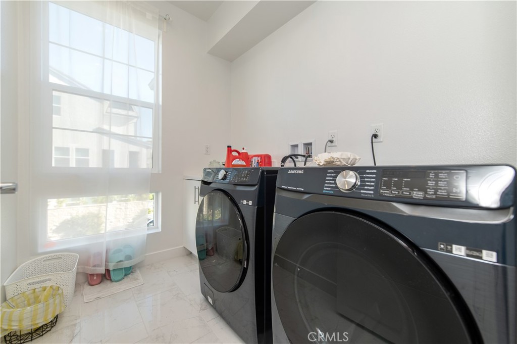 131 Reyes Alley Lake Forest, CA 92630 - Photo 35 of 39 a view of a dining room with furniture and chandelier