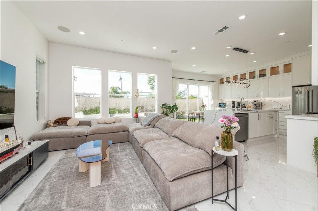 131 Reyes Alley Lake Forest, CA 92630 - Photo 8 of 39 a living room with furniture and a large window