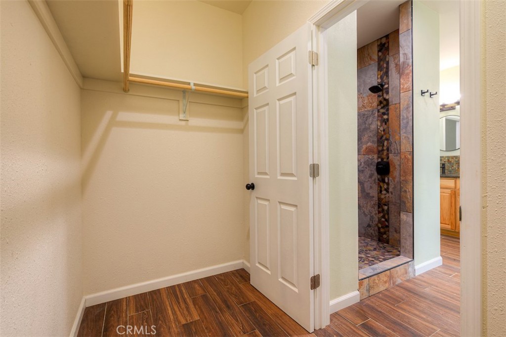 13159 Mullen Way Oroville, CA 95965 - Photo 17 of 50 a view of a hallway with wooden floor and closet
