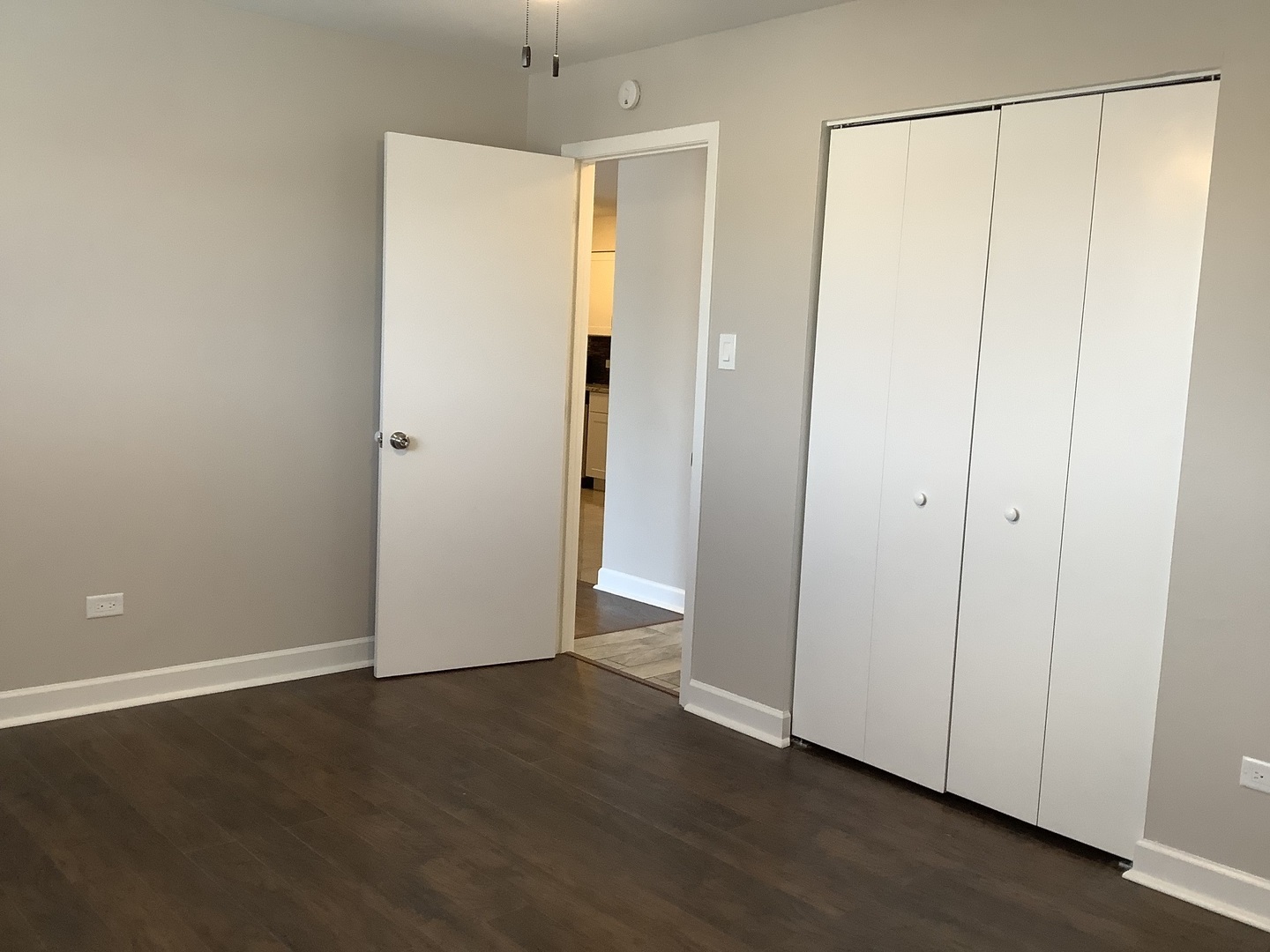 10530 Parkside Avenue, Unit 10 Chicago Ridge, IL 60415 - Photo 15 of 30 a view of an empty room with wooden floor