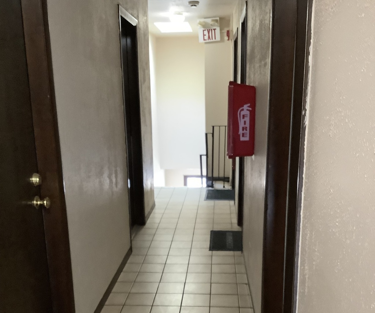 10530 Parkside Avenue, Unit 10 Chicago Ridge, IL 60415 - Photo 22 of 30 a hallway with a door and a hallway