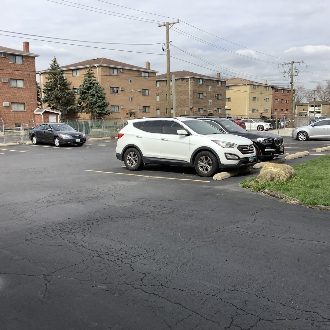 10530 Parkside Avenue, Unit 10 Chicago Ridge, IL 60415 - Photo 29 of 30 a view of cars parked in a parking lot