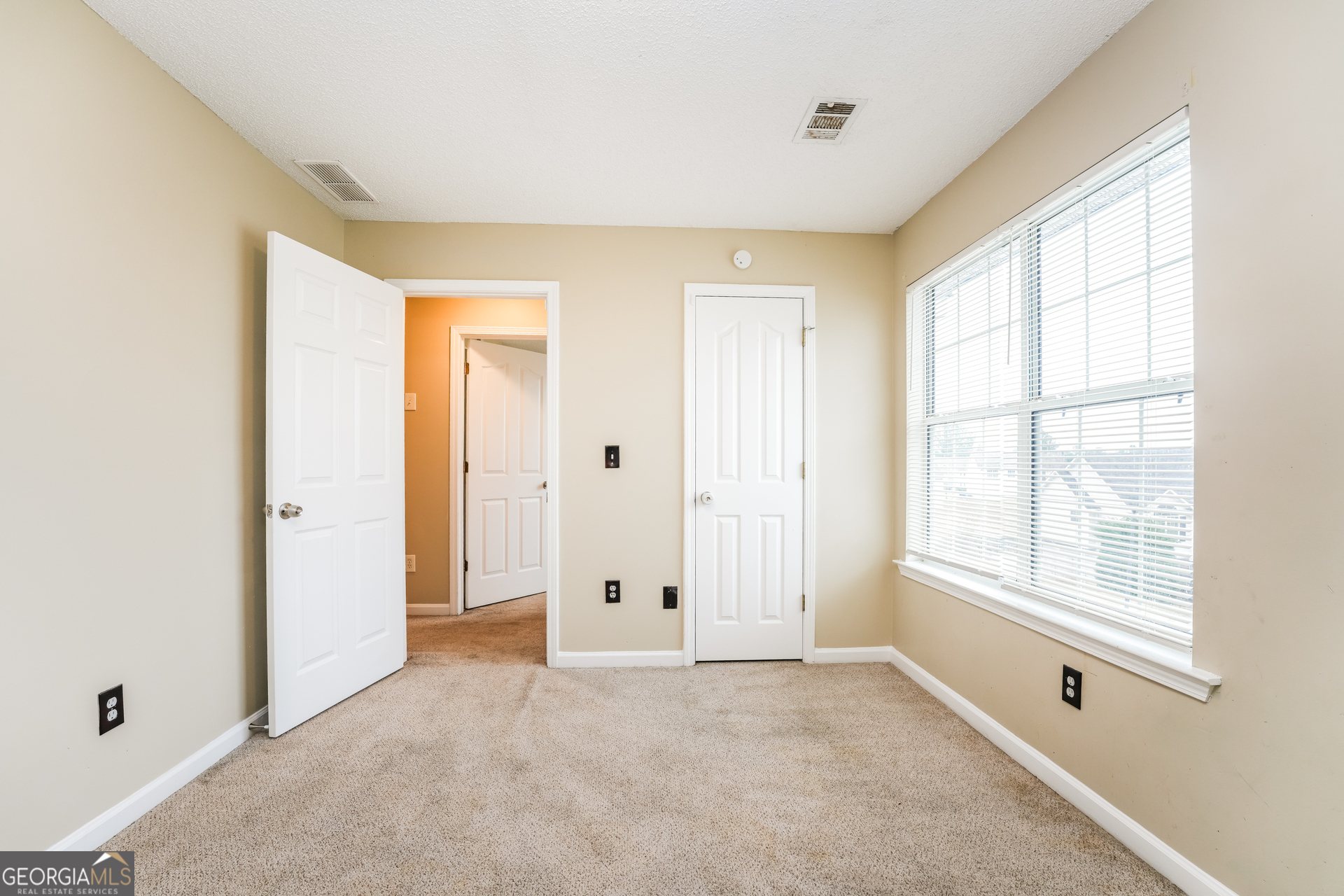 573 Ransom Way Stockbridge, GA 30281 - Photo 12 of 17 a view of an empty room with a window