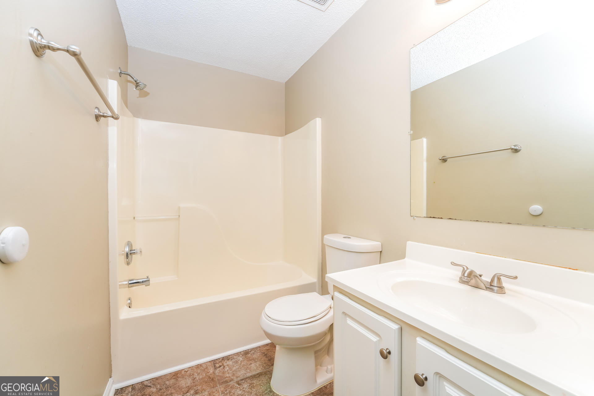 573 Ransom Way Stockbridge, GA 30281 - Photo 13 of 17 a bathroom with a sink a toilet and shower
