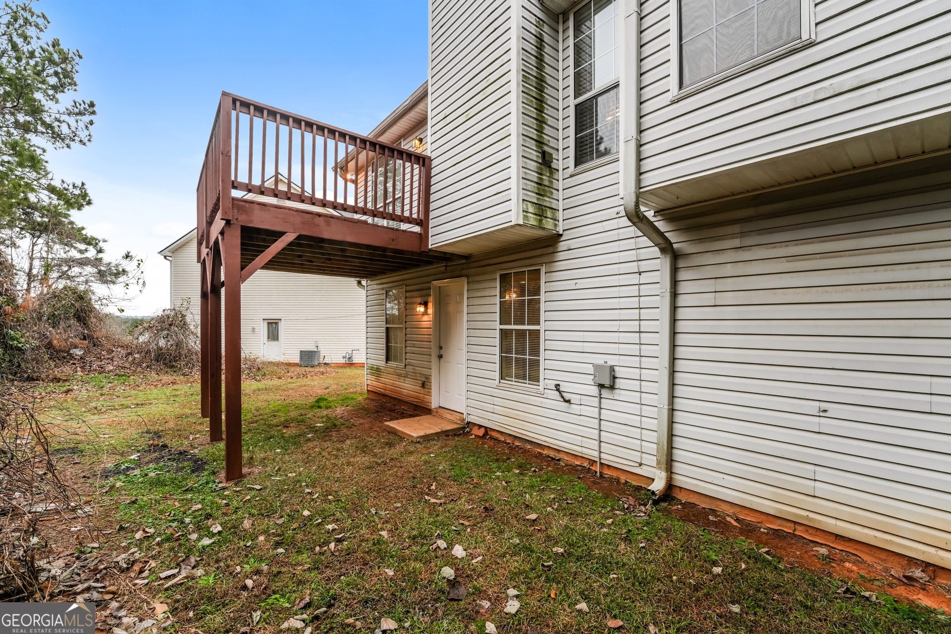 573 Ransom Way Stockbridge, GA 30281 - Photo 14 of 17 a view of a house with backyard and deck