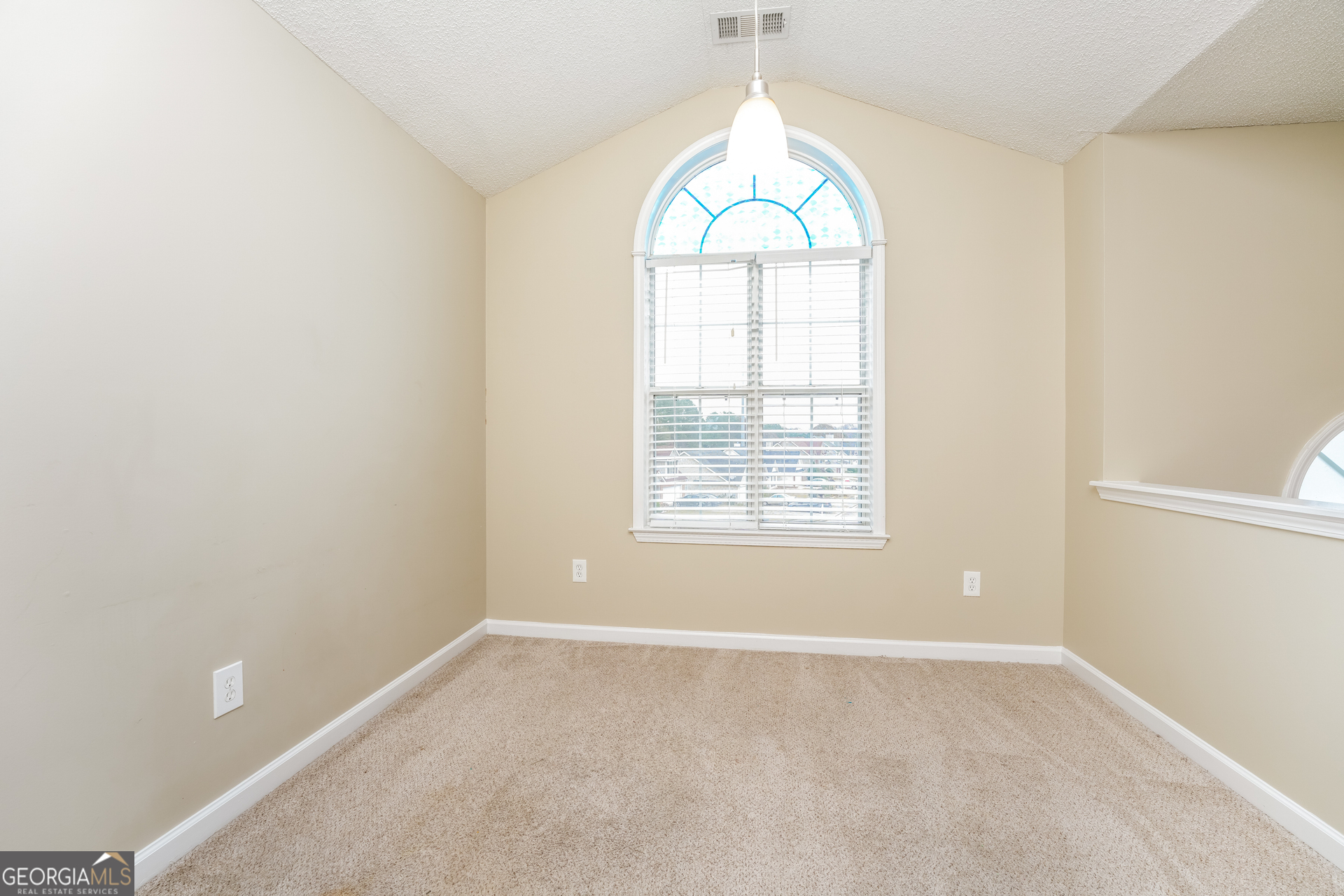 573 Ransom Way Stockbridge, GA 30281 - Photo 4 of 17 an empty room with windows