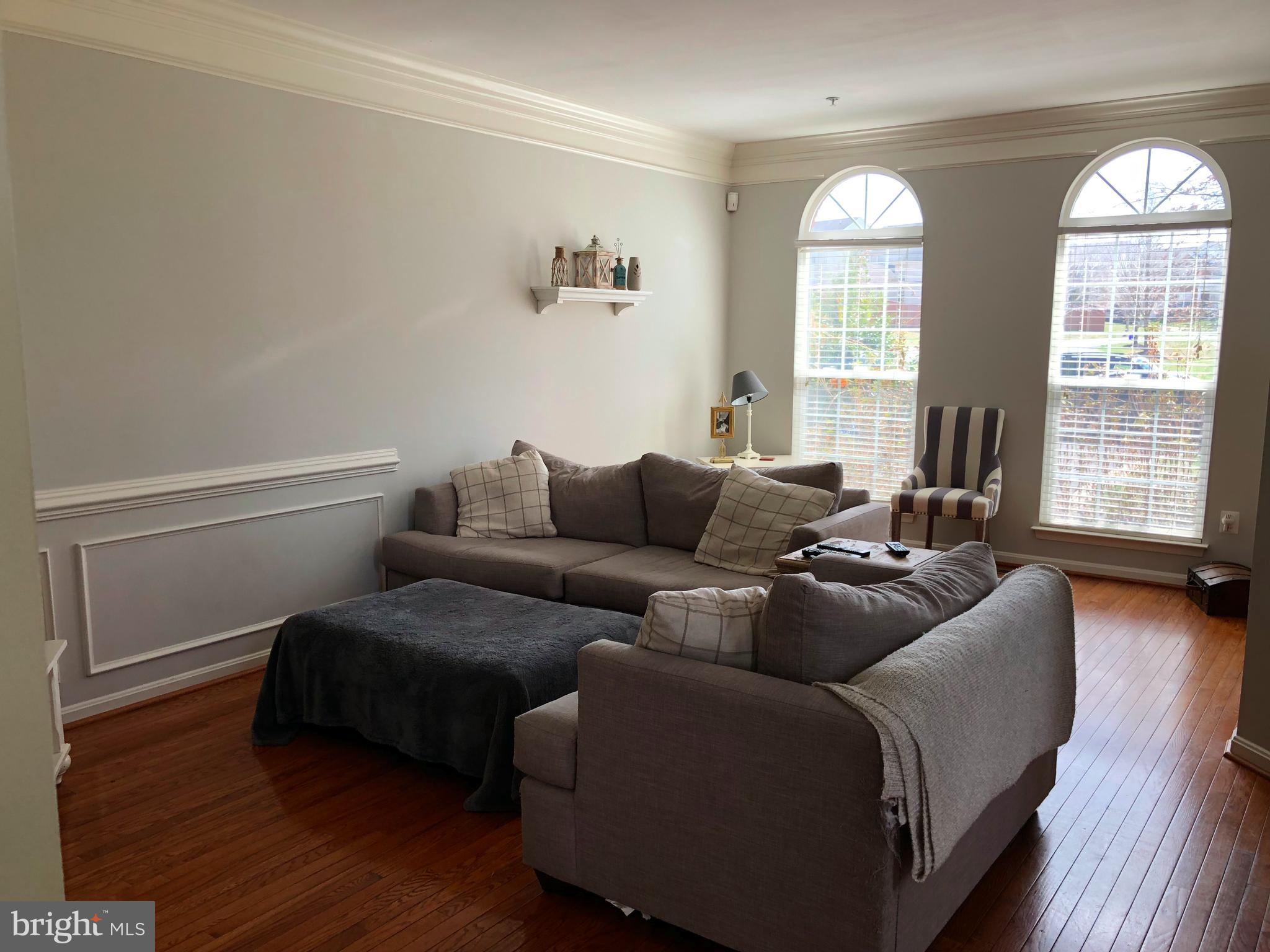 18720 Broken Oak Road Boyds, MD 20841 - Photo 9 of 18 a living room with furniture and a large window