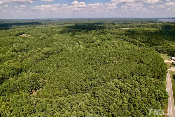 a view of a garden with a building in the background