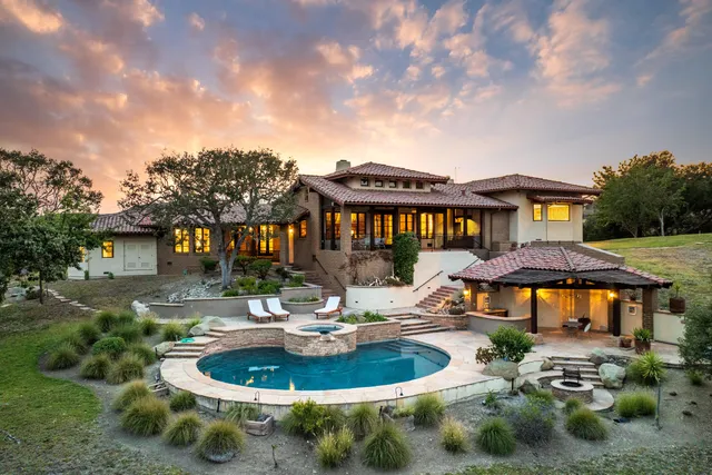 a swimming pool with outdoor seating yard and barbeque oven