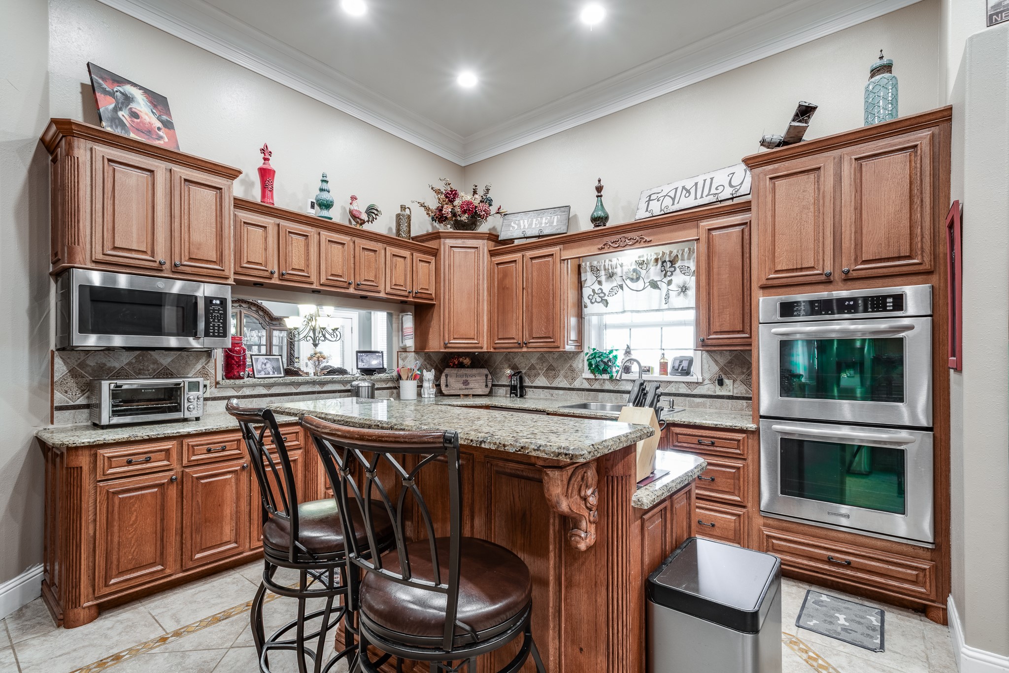 11105 Crockett Martin Road Conroe, TX 77306 - Photo 15 of 35 a kitchen with stainless steel appliances granite countertop a stove and a refrigerator