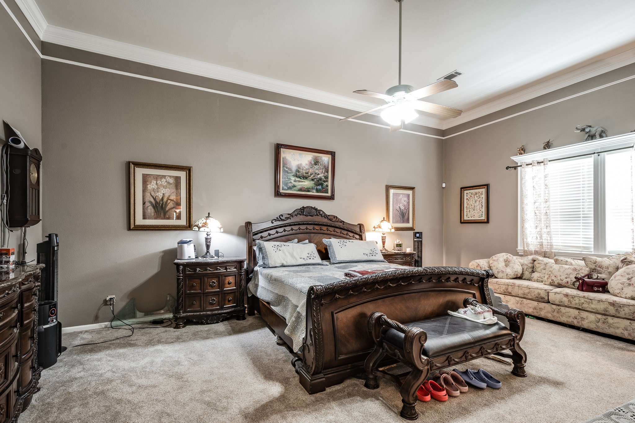 11105 Crockett Martin Road Conroe, TX 77306 - Photo 17 of 35 a bedroom with a bed a couch and a flat tv screen