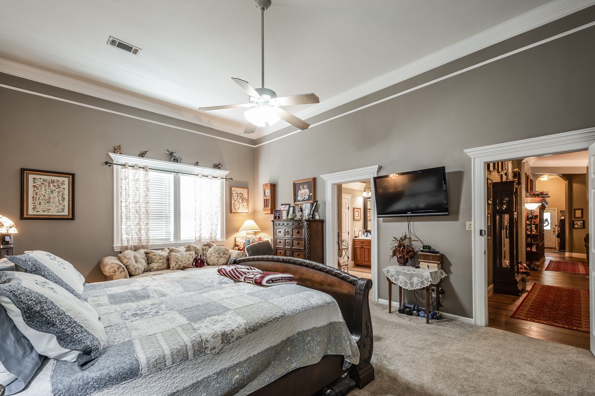 11105 Crockett Martin Road Conroe, TX 77306 - Photo 18 of 35 a bedroom with a bed and a flat screen tv