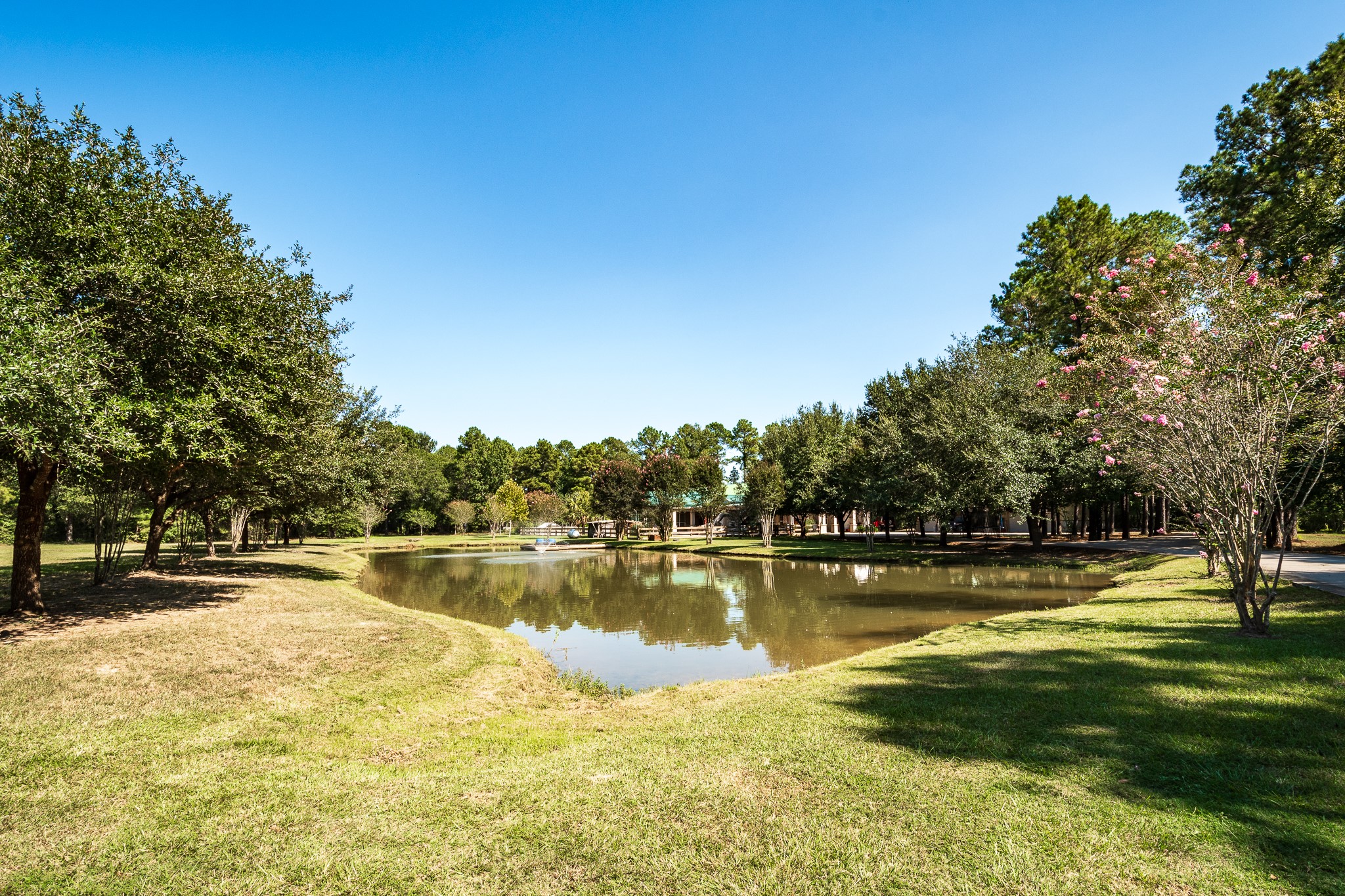 11105 Crockett Martin Road Conroe, TX 77306 - Photo 31 of 35 a view of a lake with houses in the back