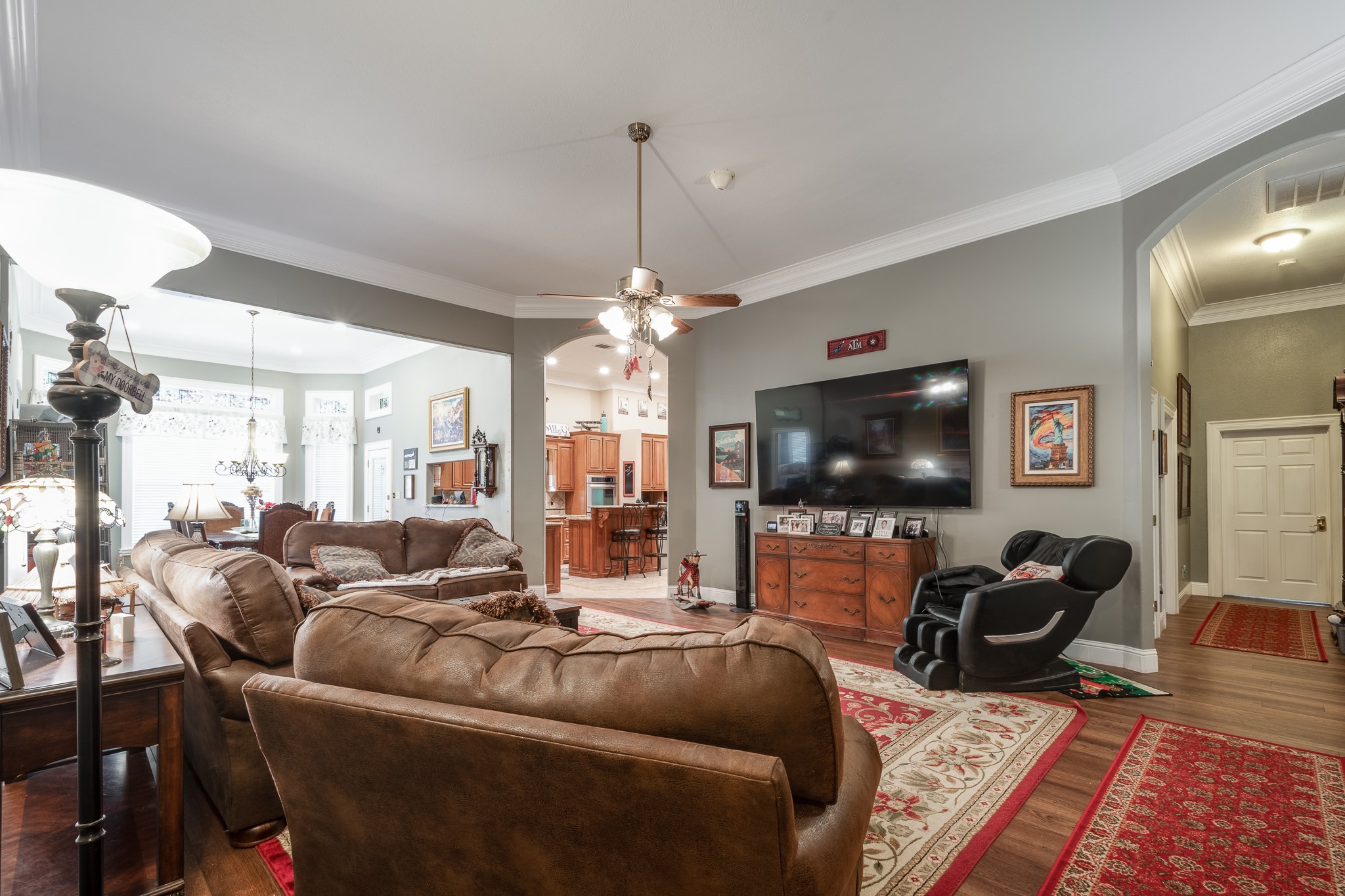 11105 Crockett Martin Road Conroe, TX 77306 - Photo 8 of 35 a living room with furniture and a flat screen tv