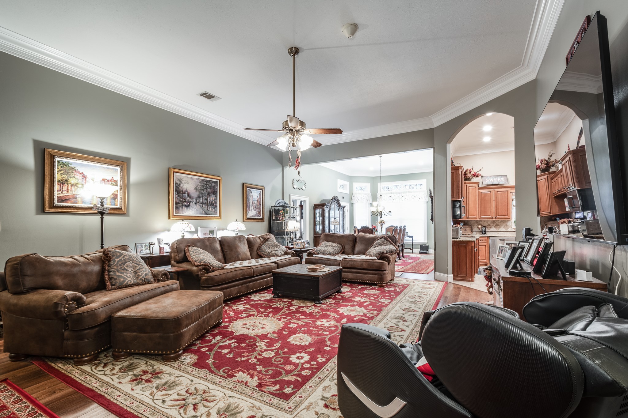 11105 Crockett Martin Road Conroe, TX 77306 - Photo 9 of 35 a living room with furniture and a chandelier
