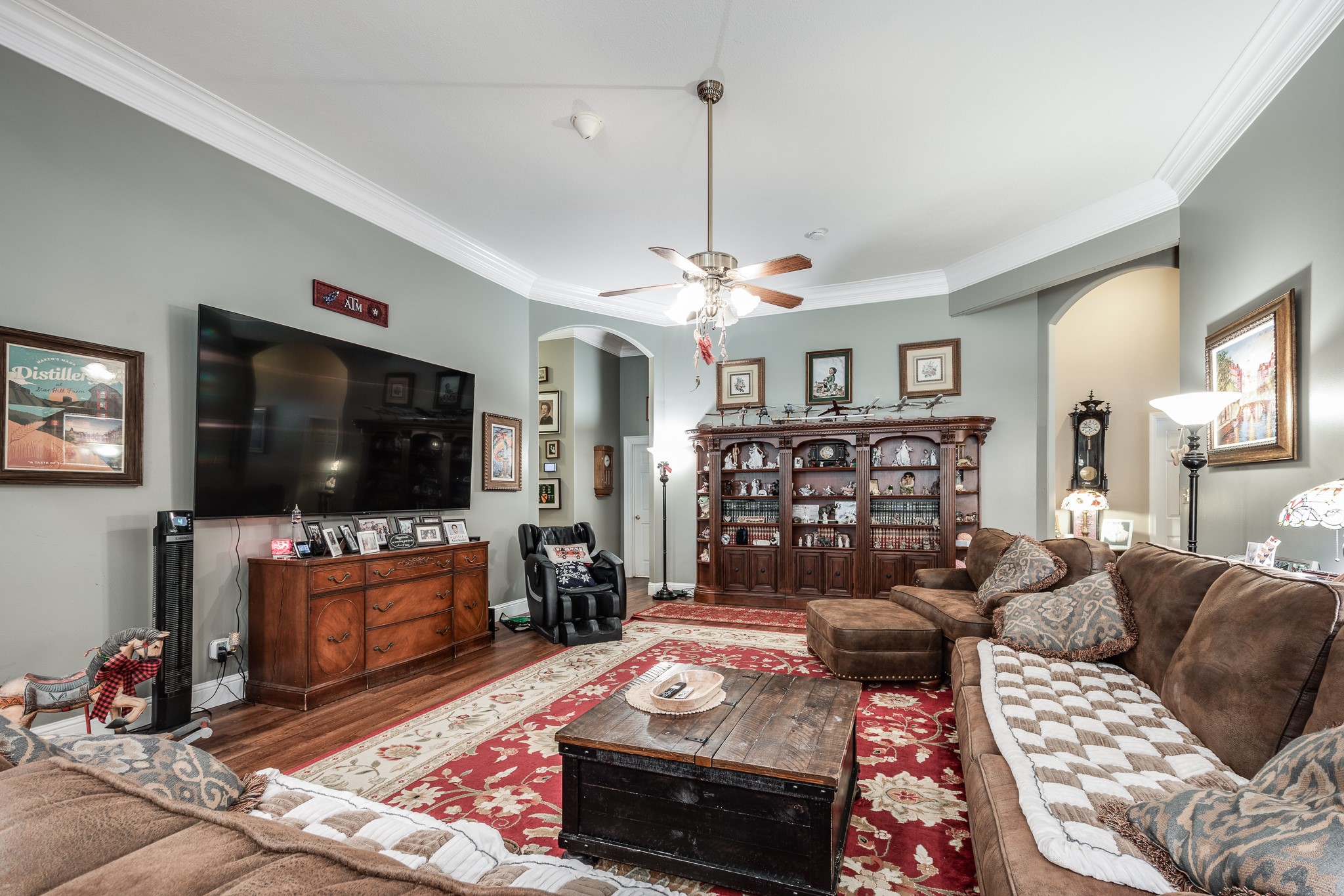 11105 Crockett Martin Road Conroe, TX 77306 - Photo 10 of 35 a living room with furniture and a flat screen tv