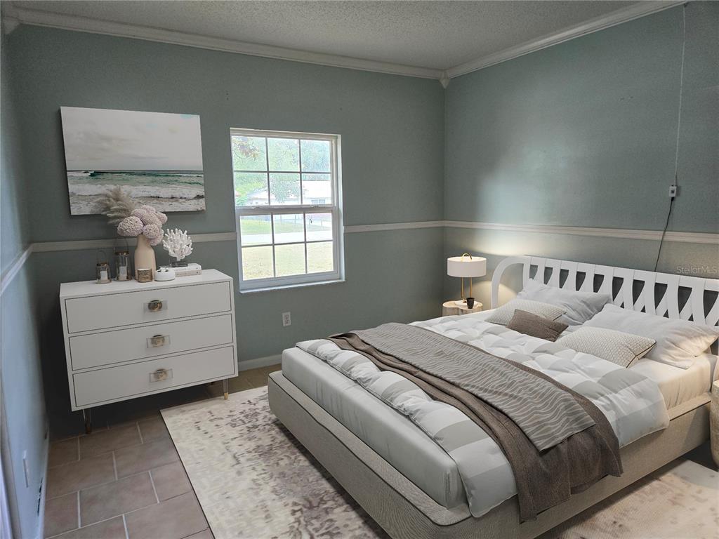 19 Spring Dr Place Ocala, FL 34472 - Photo 16 of 29 a bedroom with a bed and a window